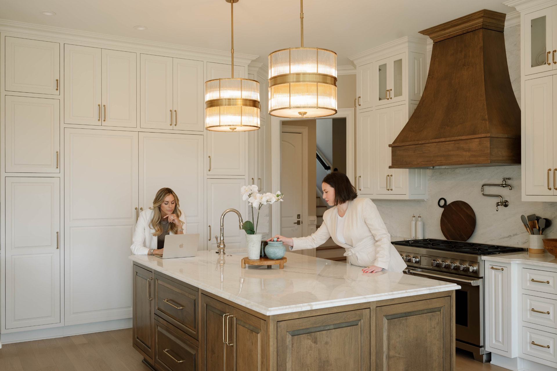 Claire Guentz and Julia Sawchak working together at a kitchen island
